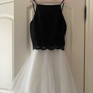 A semi short black w/ white ruffles cocktail dress